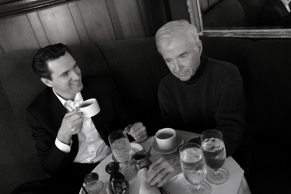 Mayor Gavin Newsom and his dad, Judge William Newsom, have lunch at a cafe