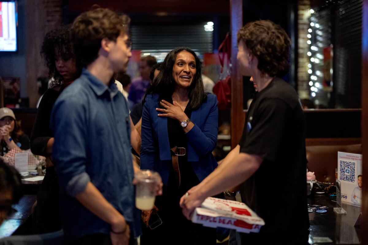 Councilwoman Nithya Raman talks to attendees