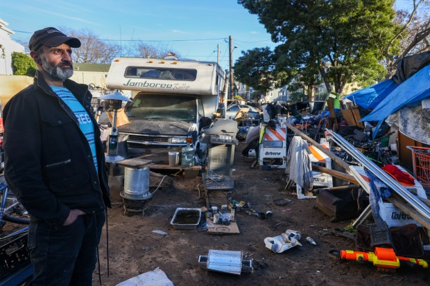Masoud Saberi, who is homeless, looks on while standing next to his RV at the homeless encampment at Pine and Guss streets in Oakland, Calif., on Tuesday, Jan. 6, 2026. (Ray Chavez/Bay Area News Group)
