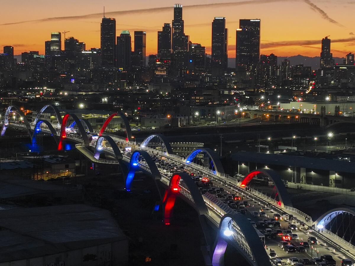 Los Angeles officials light the 20 arches dubbed the "Ribbon of Light" on the new 6th Street Viaduct.