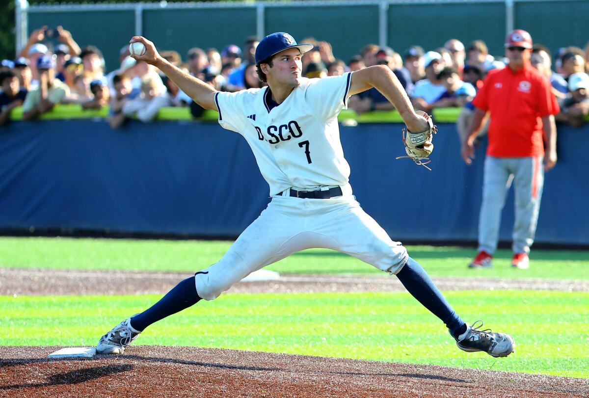 St. John Bosco pitcher Jack Champlin strides forward with arm cocked to deliver a pitch