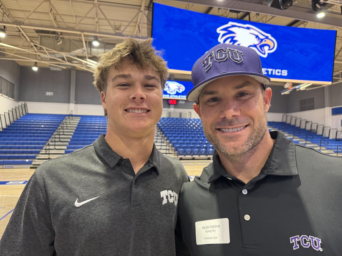 Santa Margarita shortstop Brody Schumaker (left) and his father, Skip, the manager of the Texas Rangers.