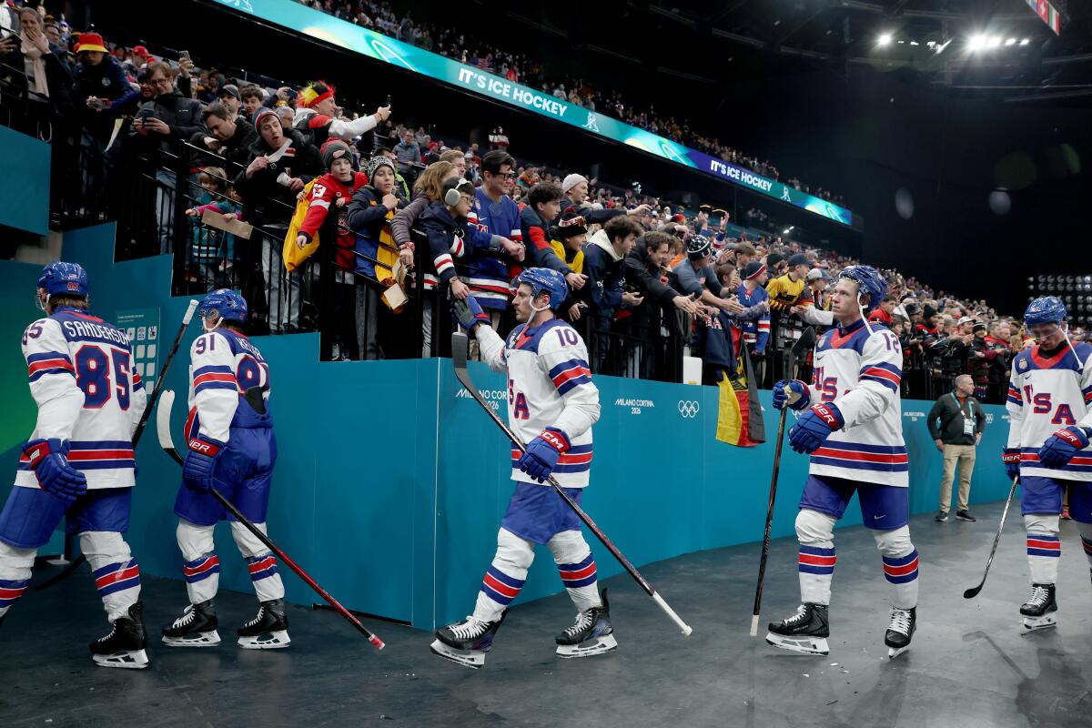 The United States men's hockey team leaves the rink after defeating Germany.