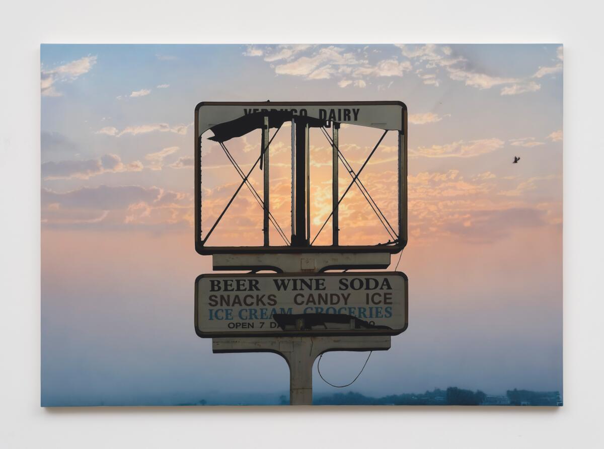 A photo of a broken sign.