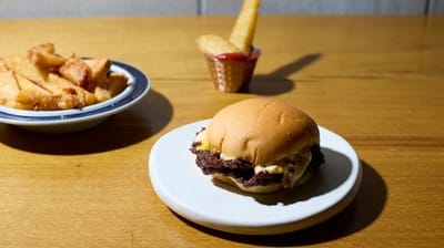 A cheeseburger with pepper sauce and fries at Zeebo's pop-up...