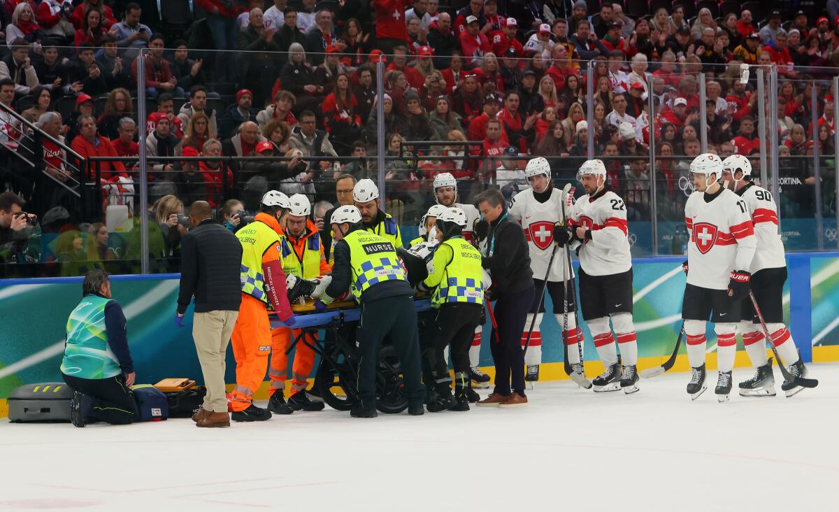 Switzerland's Kevin Fiala is attended to by medical staff after sustaining a broken leg against Canada on Friday. 