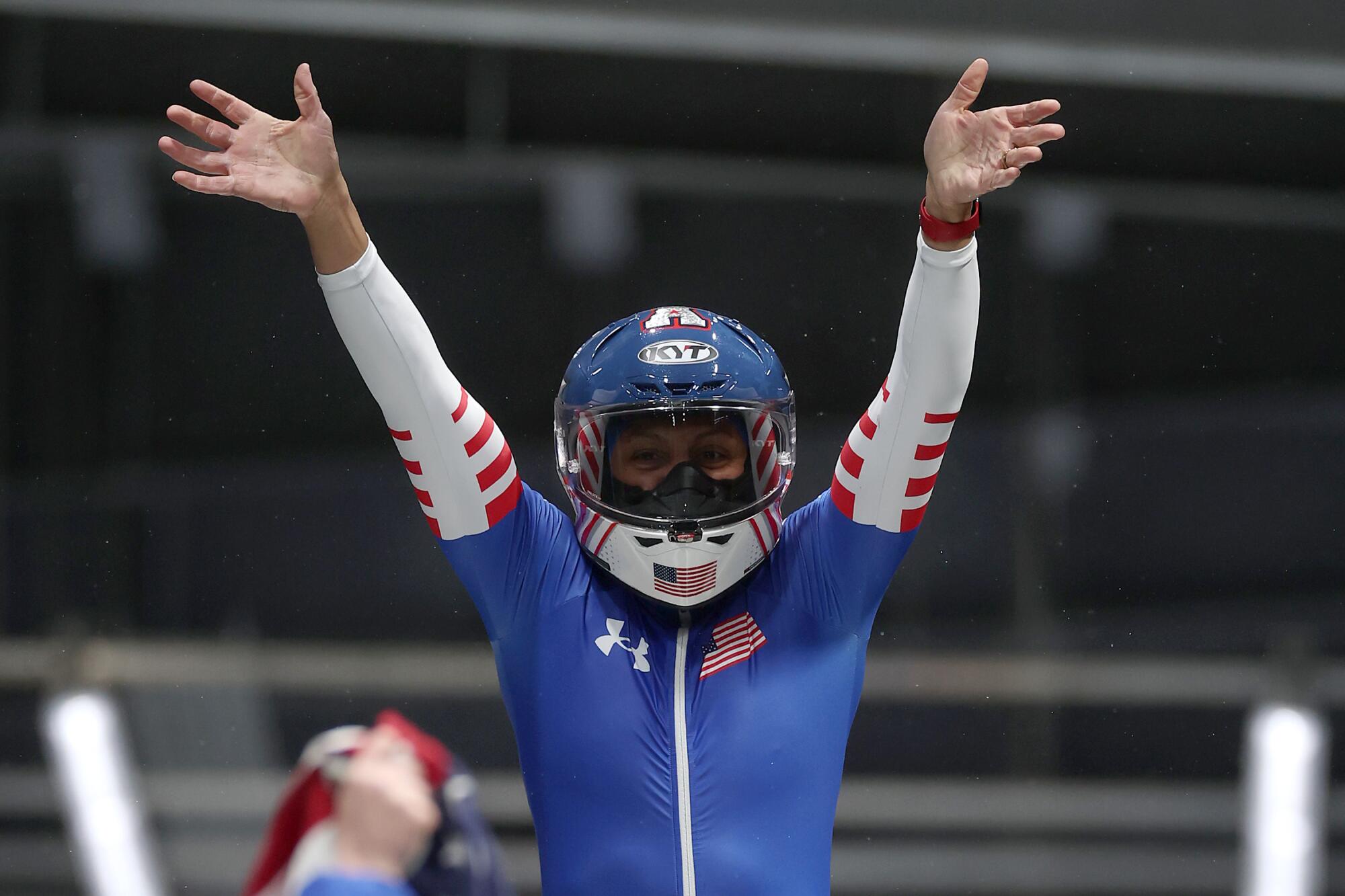 American Elana Meyers Taylor celebrates after winning the monobob bobsled competition in Cortina d'Ampezzo, Italy.