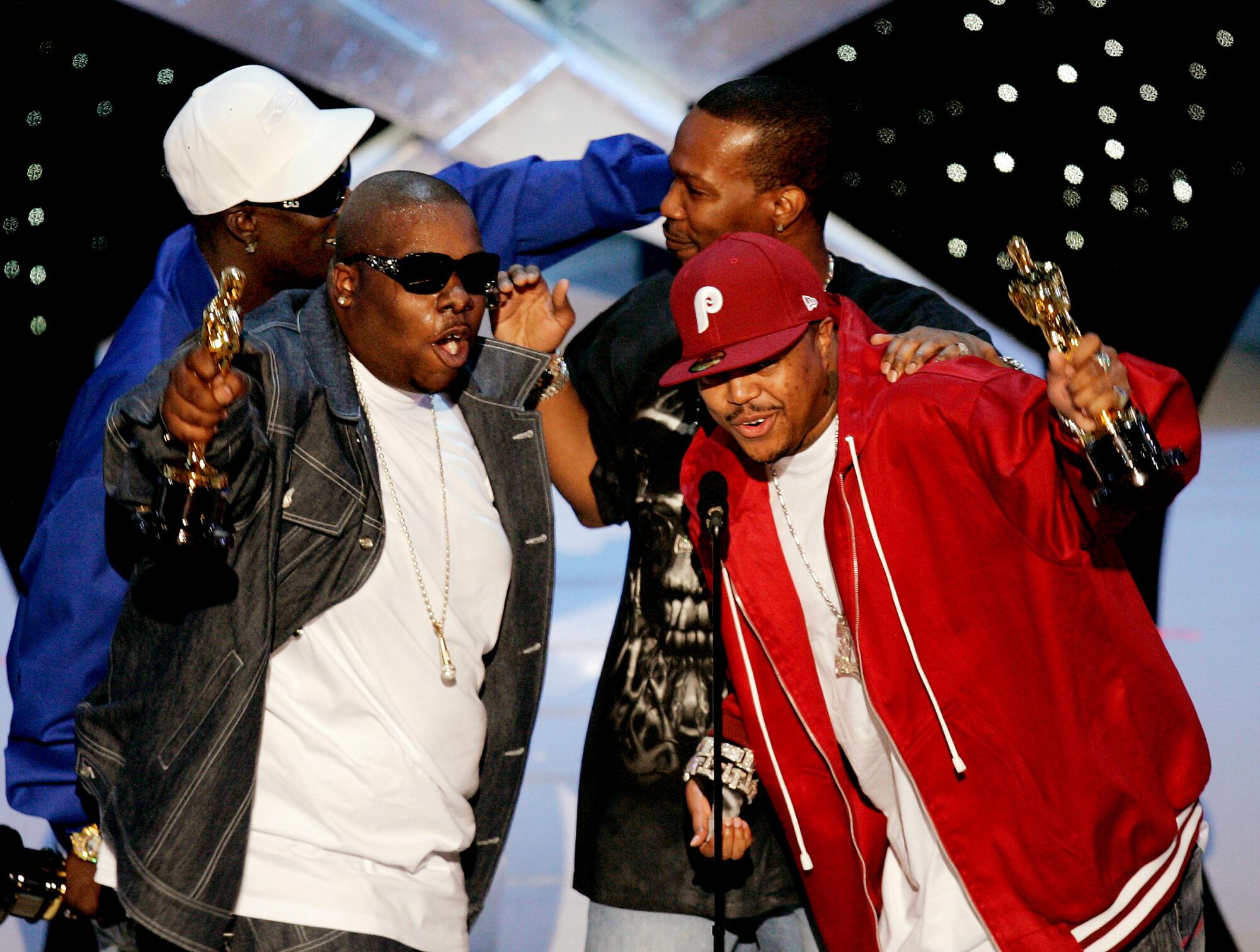 Songwriter Cedric Coleman, left front, and members from the Memphis rap group Three 6 Mafia