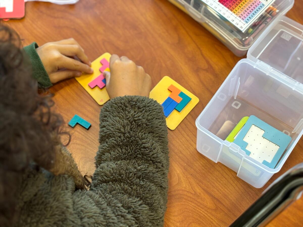 A student in Andrea Quinn's class works on a morning activity.