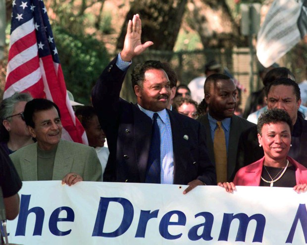 FILE PHOTO Jesse Jackson, center, waves while marching with radio personality Kasey Kasem, left, and State Sen. Barbara Lee, D-Oakland, toward the State Capitol in Sacramento, Calif., Monday Oct. 27, 1997. Jackson led a group of hundreds in a march to protest against California's anti-affirmative action policies. (AP Photo/Eric Risberg)