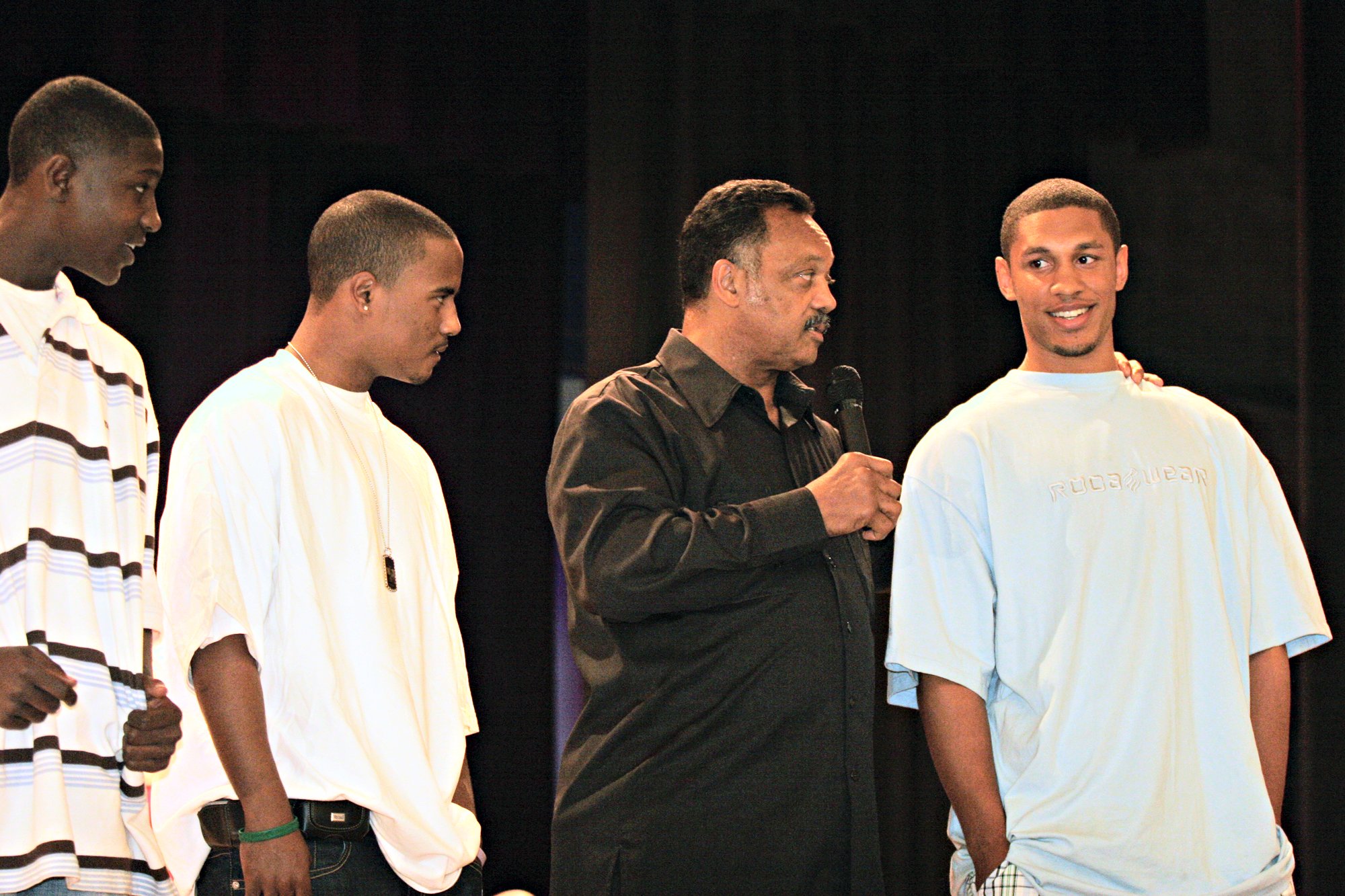 The Rev. Jesse Jackson, second from right, questions McClymonds High...