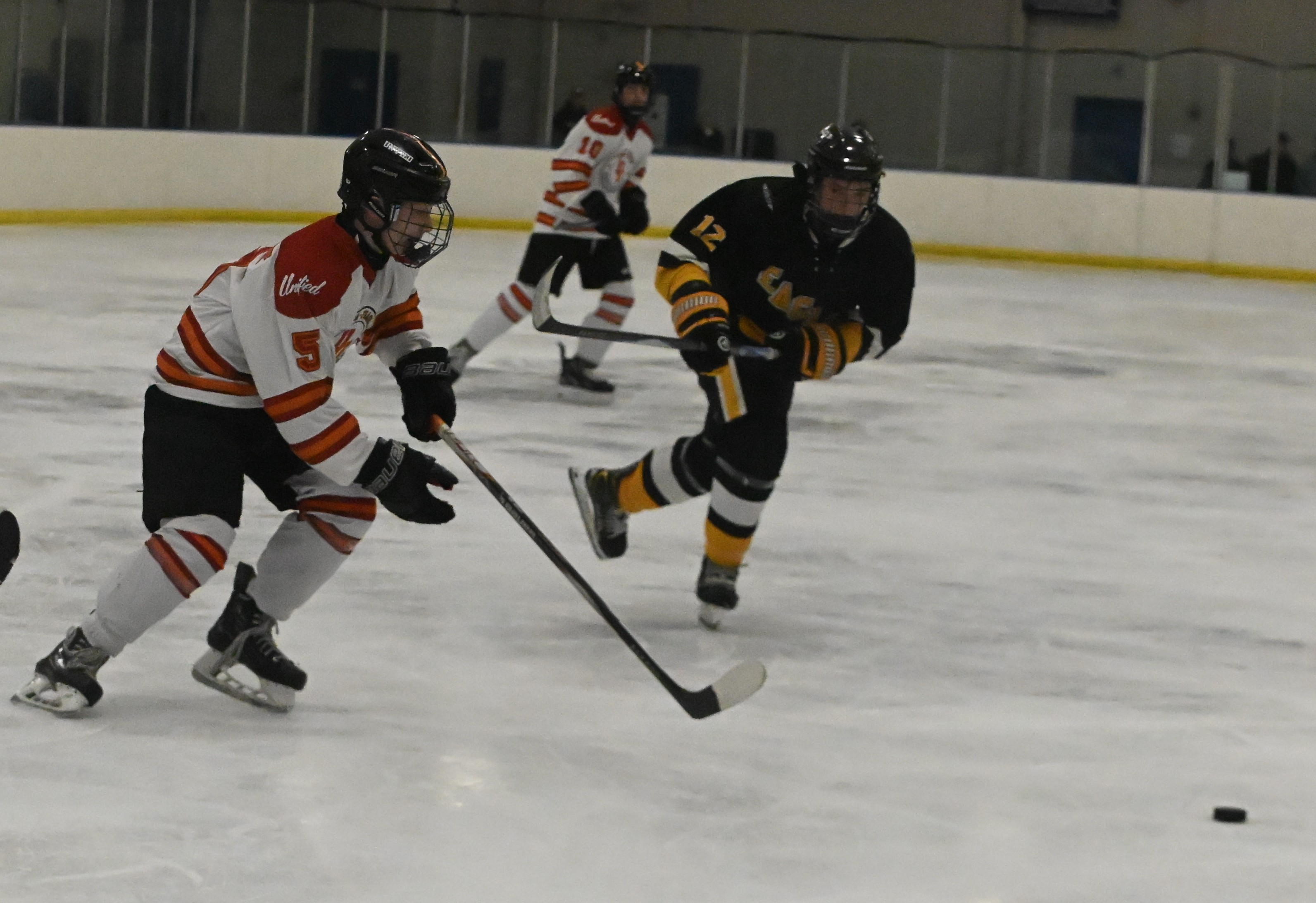 Utica-Fraser United's Nick Bandy (5) and North Oakland United's Mike...