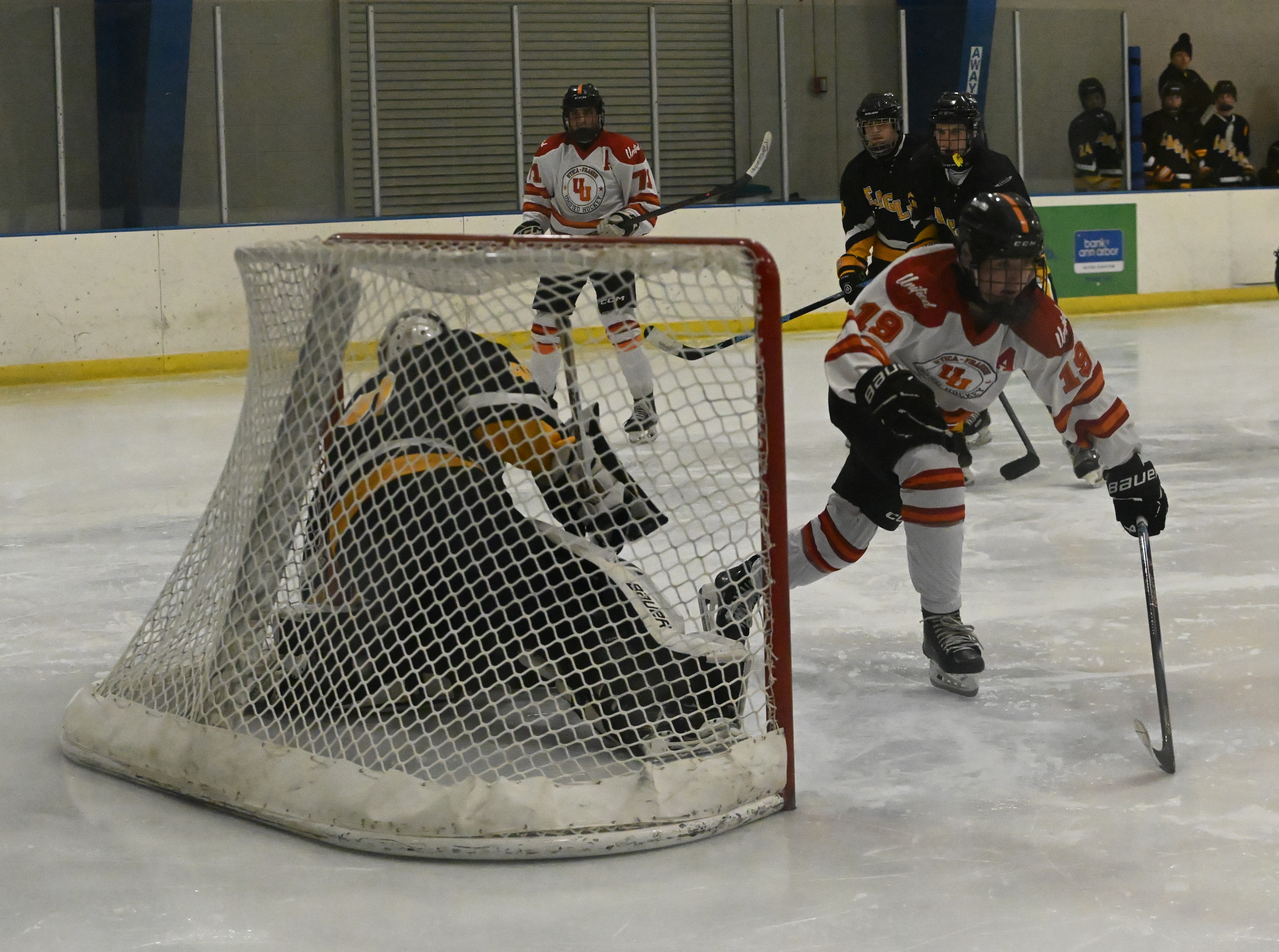 Utica-Fraser United's Nate Sheridan (19) gets ready to celebrate after...