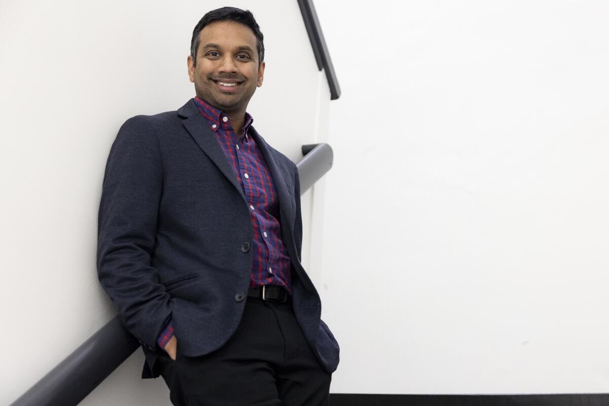 Center Theatre Group's artistic director, Snehal Desai, poses in a stairwell