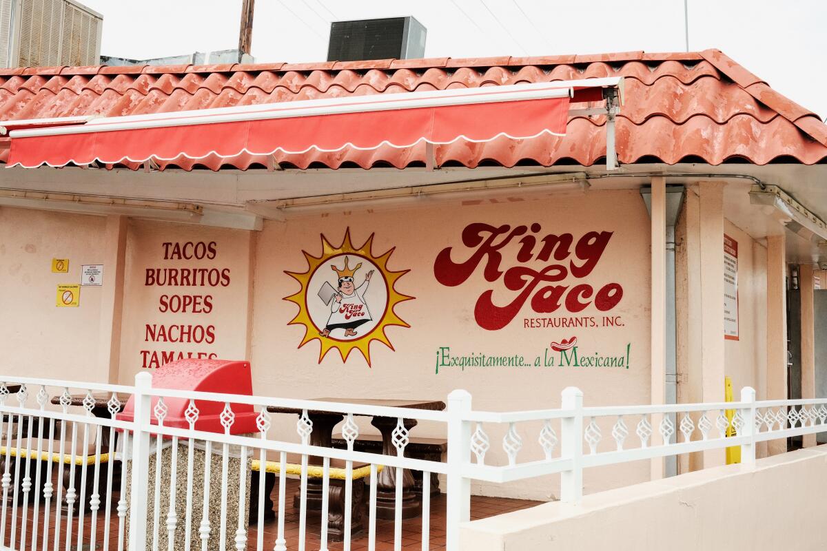 An exterior of King Taco's original location, in Cypress Park. A view of the back wall and back patio.