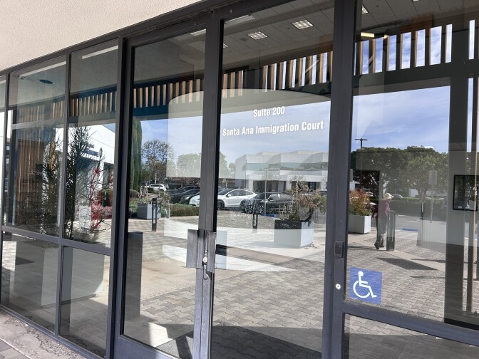 Glass doors with lettering reading "Santa Ana Immigration Court".