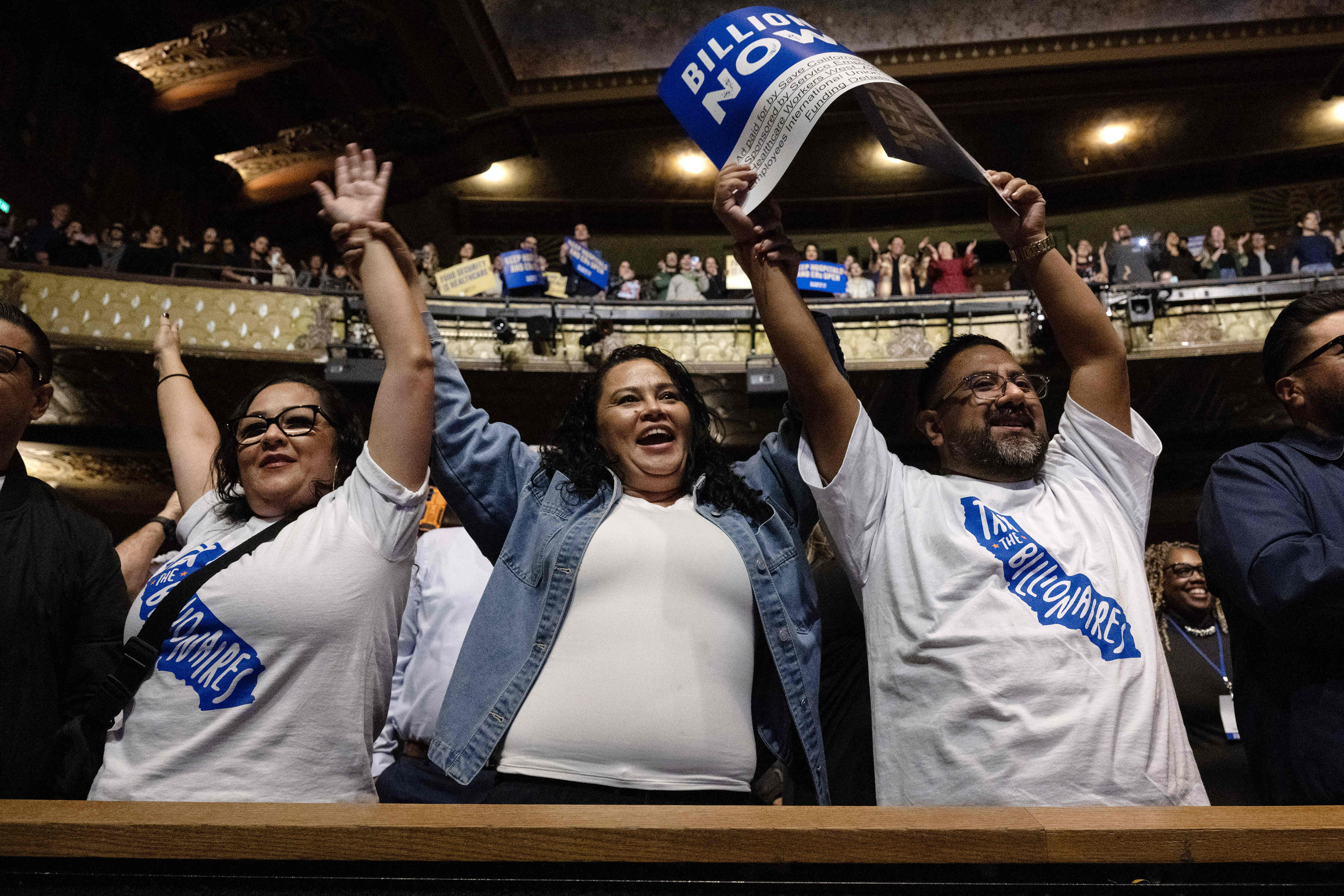 Tania Siguenza, center, attends a rally in support of a...