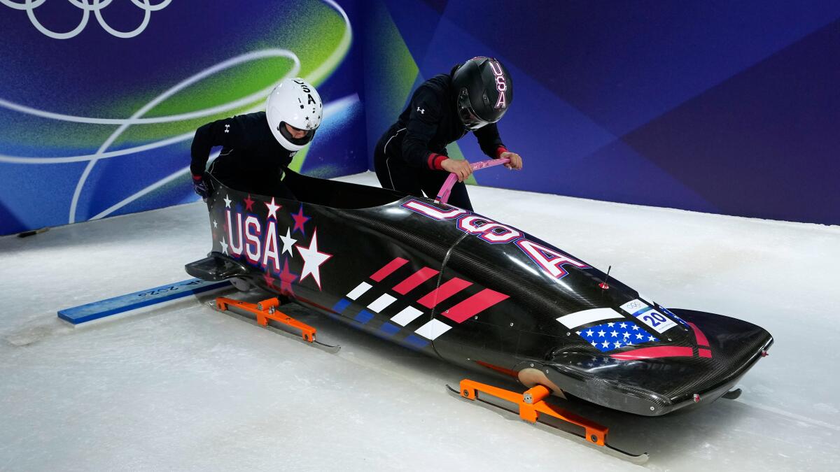 U.S. bobsledders Azaria Hill, left, and Kaysha Love take part in a training run Wednesday in Cortina d'Ampezzo, Italy.