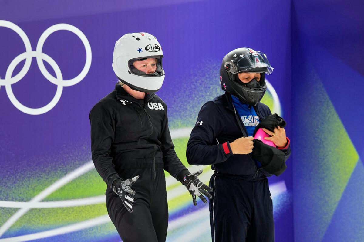 Jadin O'Brien, left, and Elana Meyers Taylor prepare for a bobsled training run.