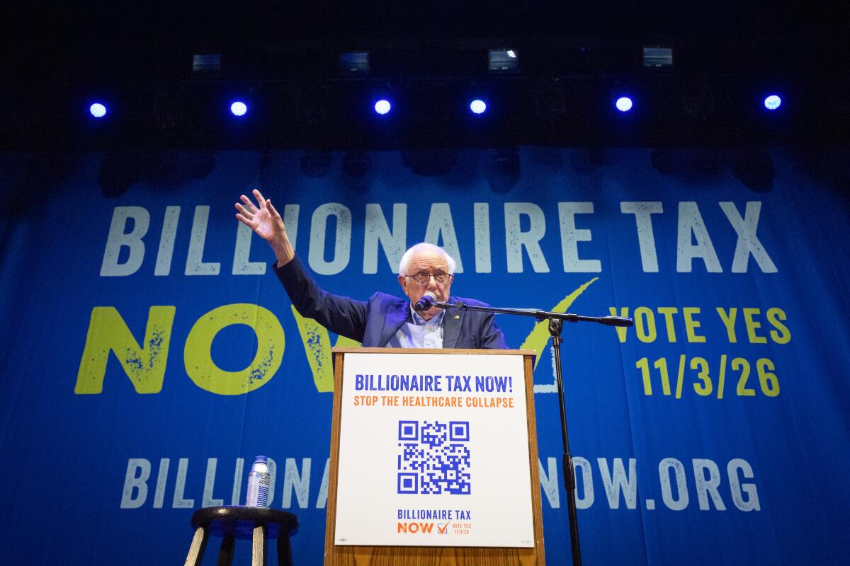 A man speaks behind a podium