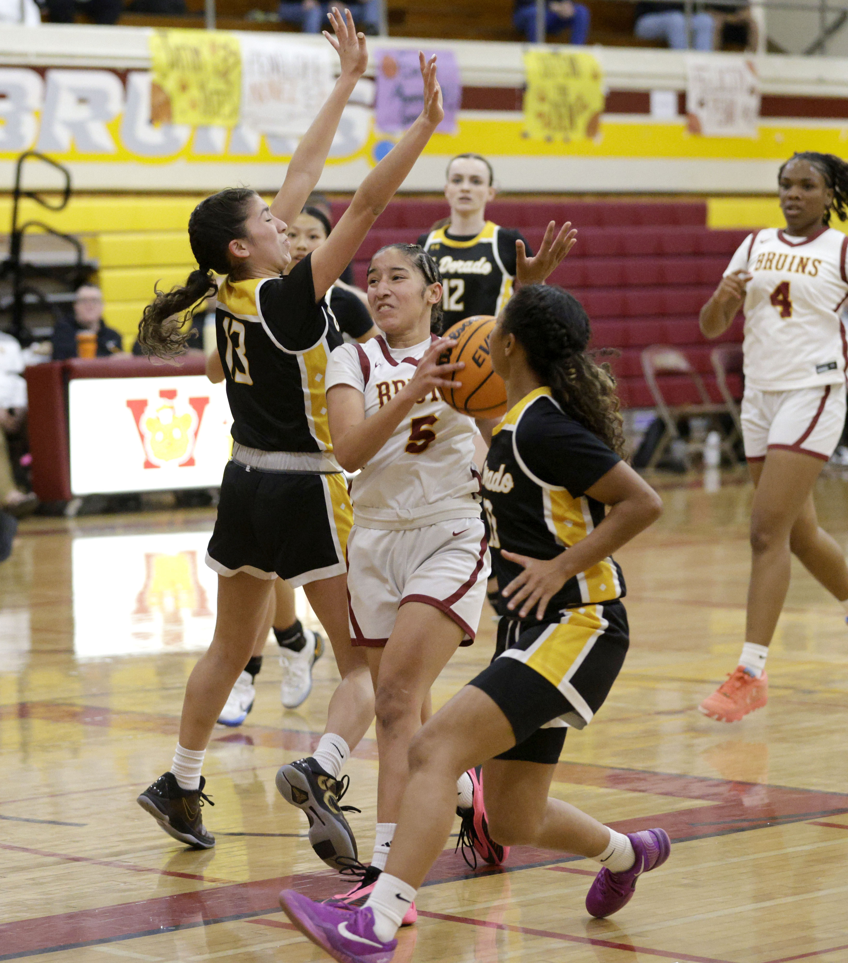 Wilson’s Emily Alvarez Smith (5) pushes past El Dorado’s Kennedy...