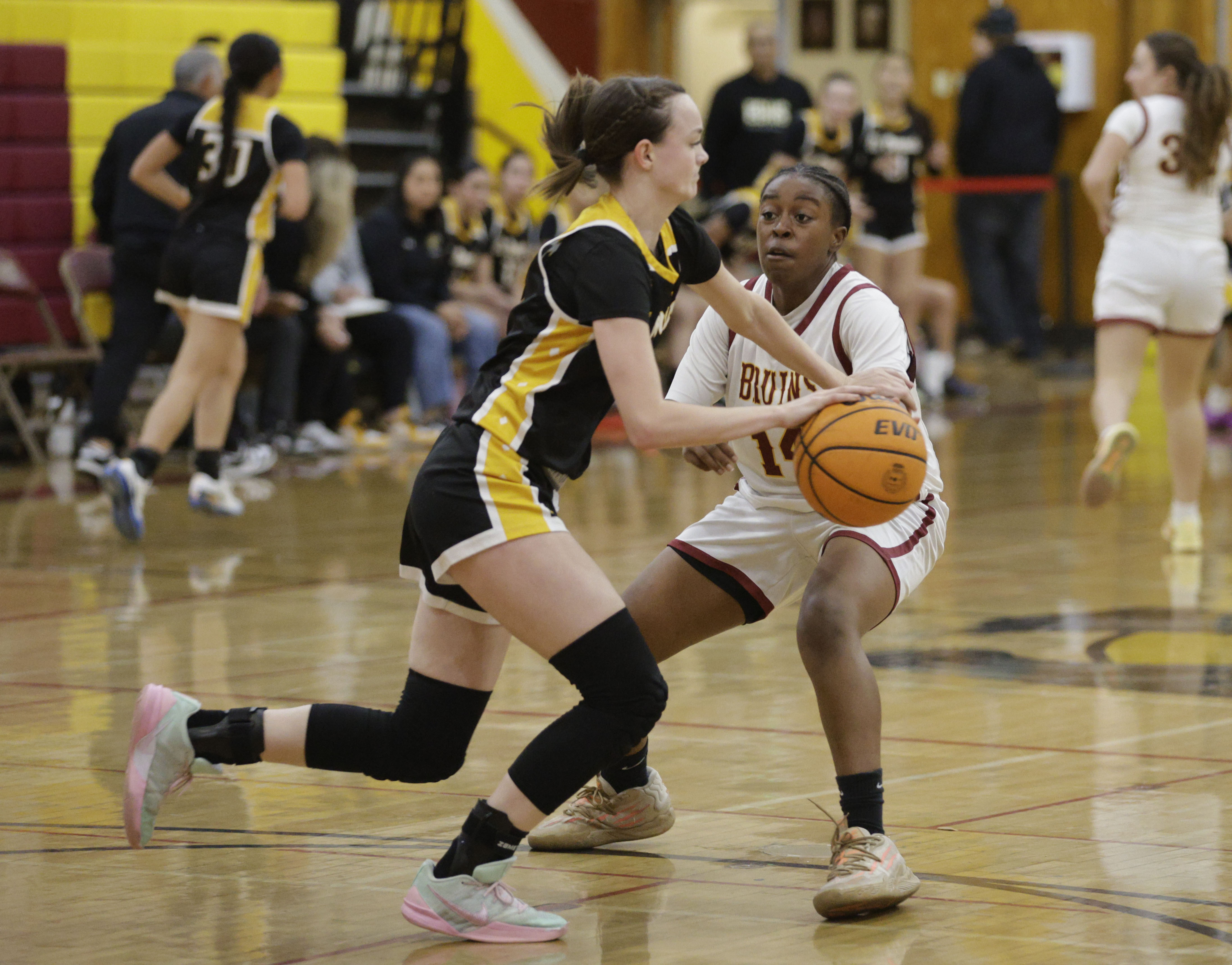 El Dorado’s Delaney Shiring (12) tries to get around Wilson’s...