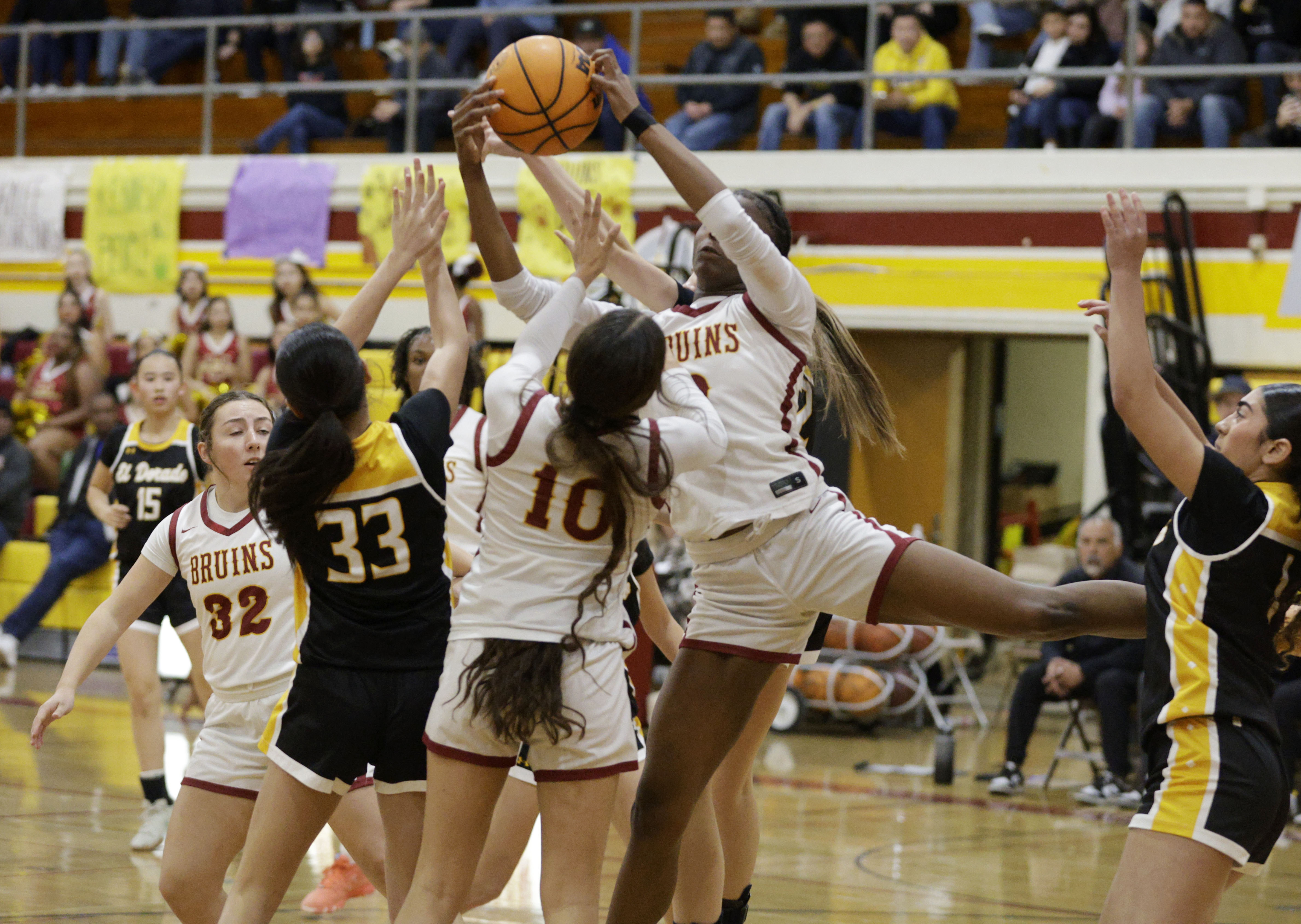Wilson’s Jordyn Jefferson (3) grabs the rebound as the Bruins...
