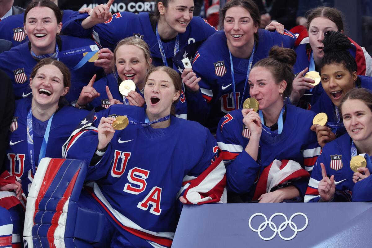 Team USA celebrates after beating Canada in overtime to win the women's hockey golden on Thursday in Milan.