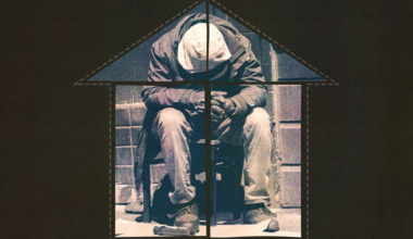A person sits on a chair with their head down, hands clasped, framed inside the outline of a house with a cross dividing it.
