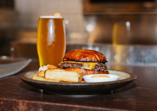 The Carter Country Regenerative Beef cheeseburger with seaweed aioli and beef tallow fries at Deckman's North restaurant in North Park. (Salsa Digital)