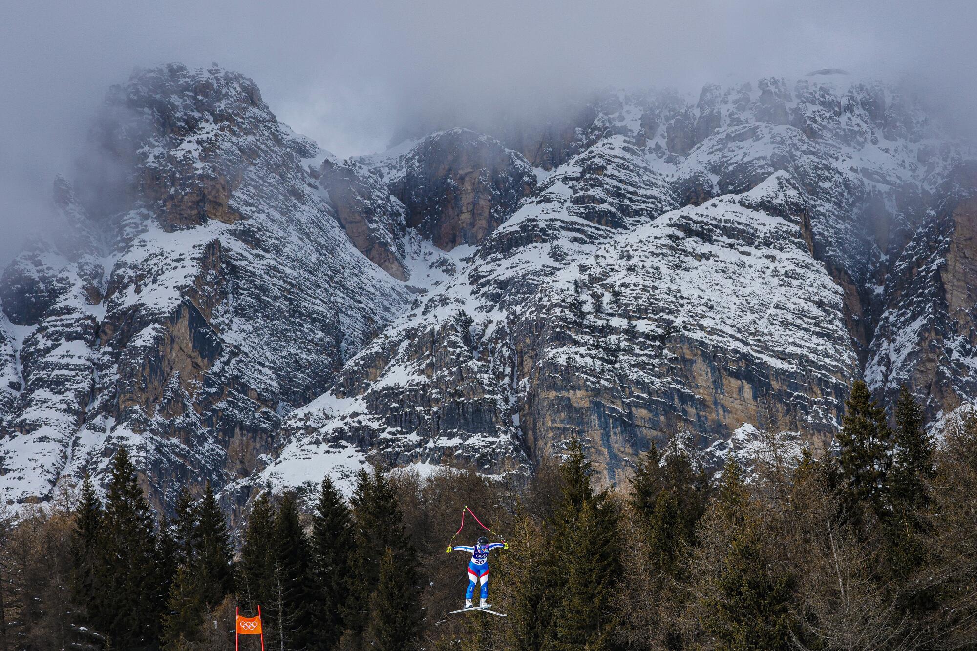 French skier Laura Gauche sails past the Dolomites on her way to the finish line in the Women's Team Combined Slalom.