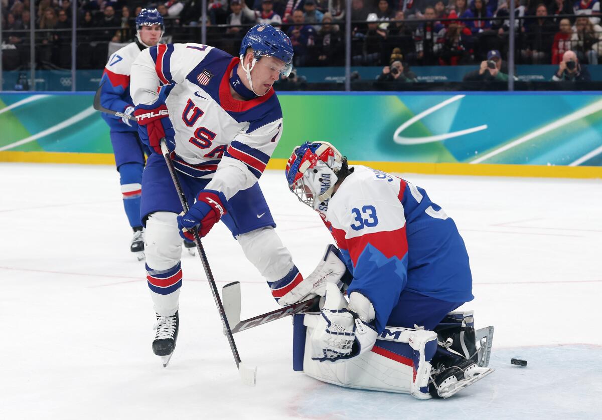 U.S. forward Brady Tkachuk slips the puck past Slovakia goalie Stanislav Skorvanek in the third period.