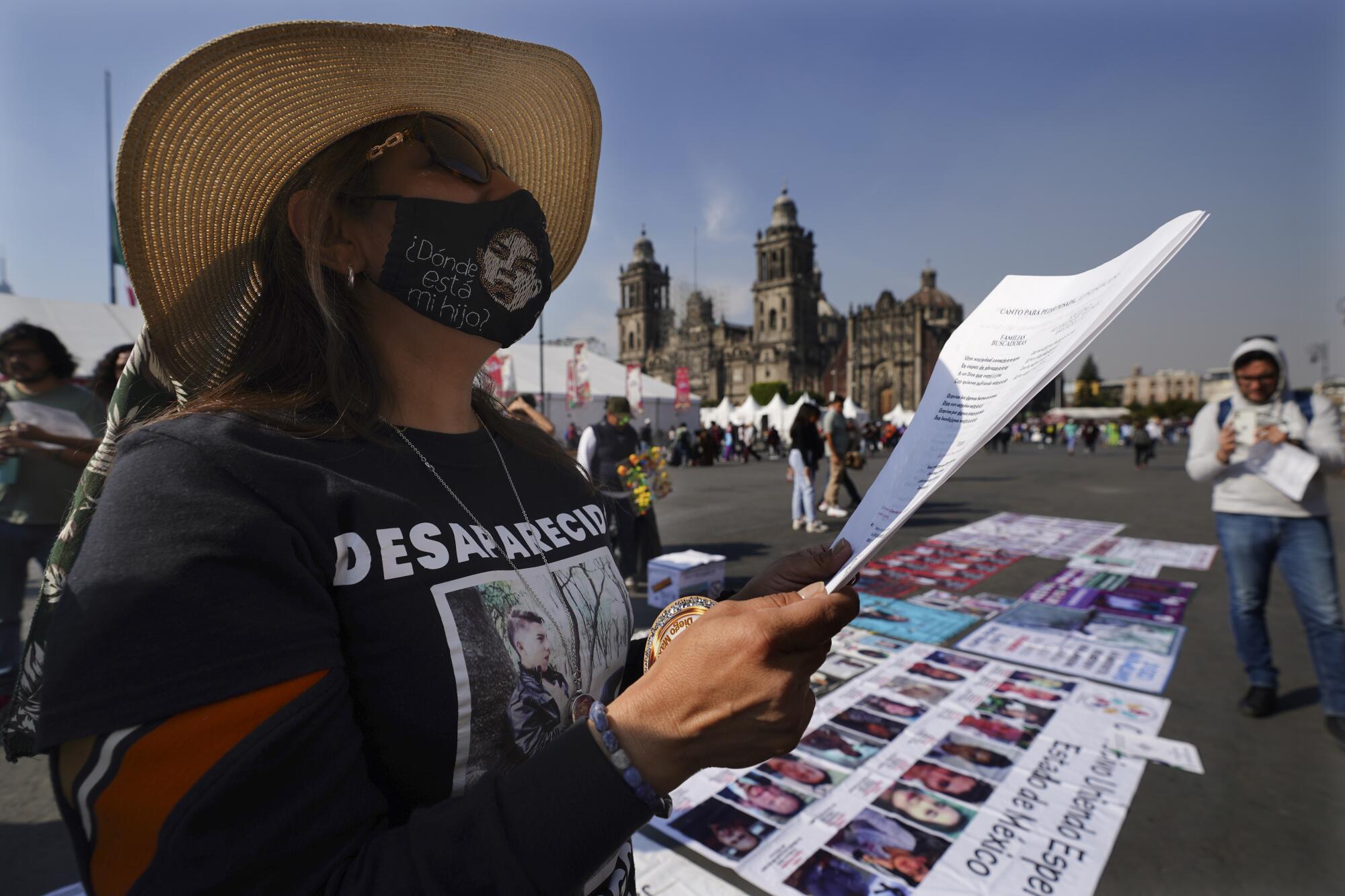 Mother Veronica Rosas holds papers during a procession