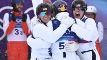 USA's Christopher Lillis, USA's Connor Curran and USA's Kaila Kuhn celebrate their victory