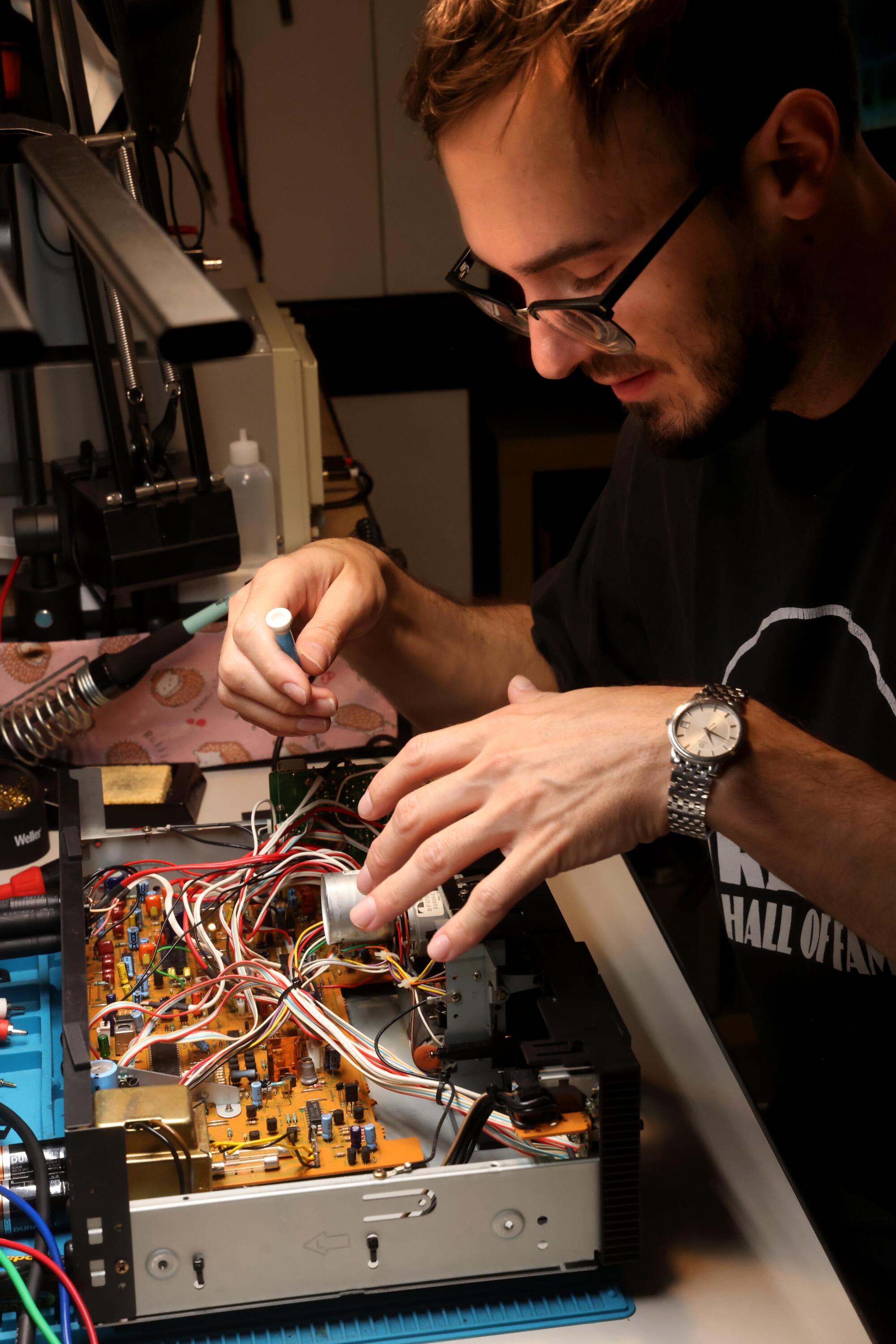 Richardson works on a Nakamichi tape deck out of his repair studio in downtown L.A.
