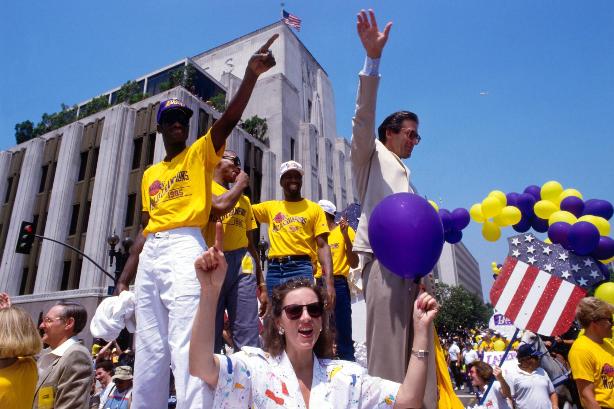 Lakers, from left, Michael Cooper, Byron Scott, Magic Johnson and coach Pat Riley during 1985 victory parade.