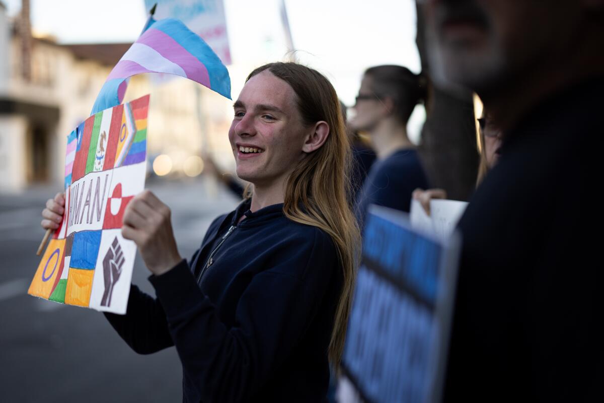 Abigail Jones participates in a protest against President Trump and his attacks on transgender people in April in Riverside.