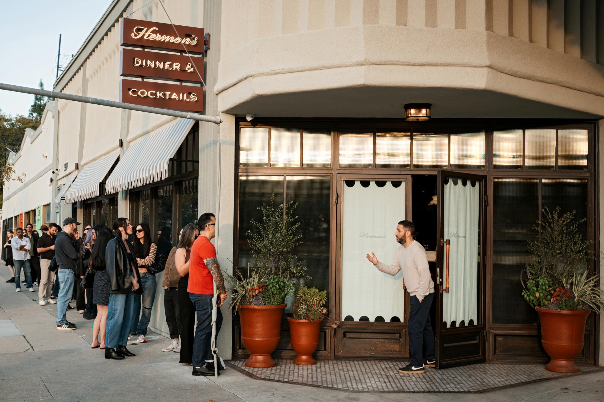 Guests line up for a chance at one of Hermon's 18 bar seats.