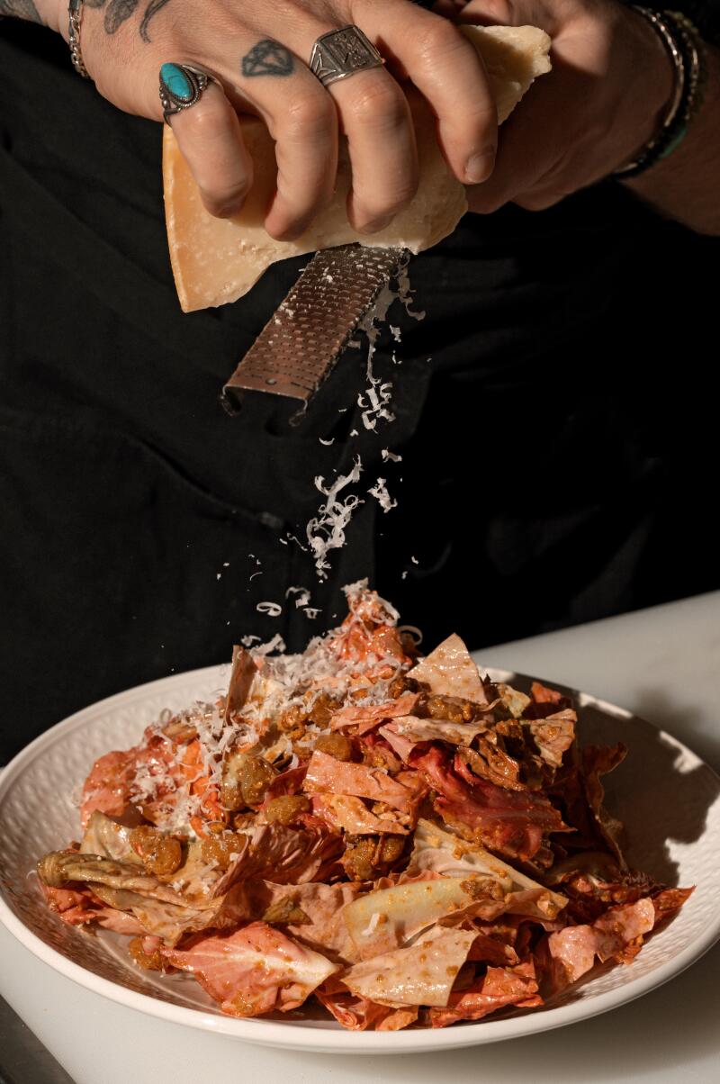 LOS ANGELES CA - FEBRUARY 7, 2026: The Chopped Chicories Salad being prepared in the kitchen at Hermon's in Los Angeles on Saturday, February 7, 2026 (Ron De Angelis / For The Times)