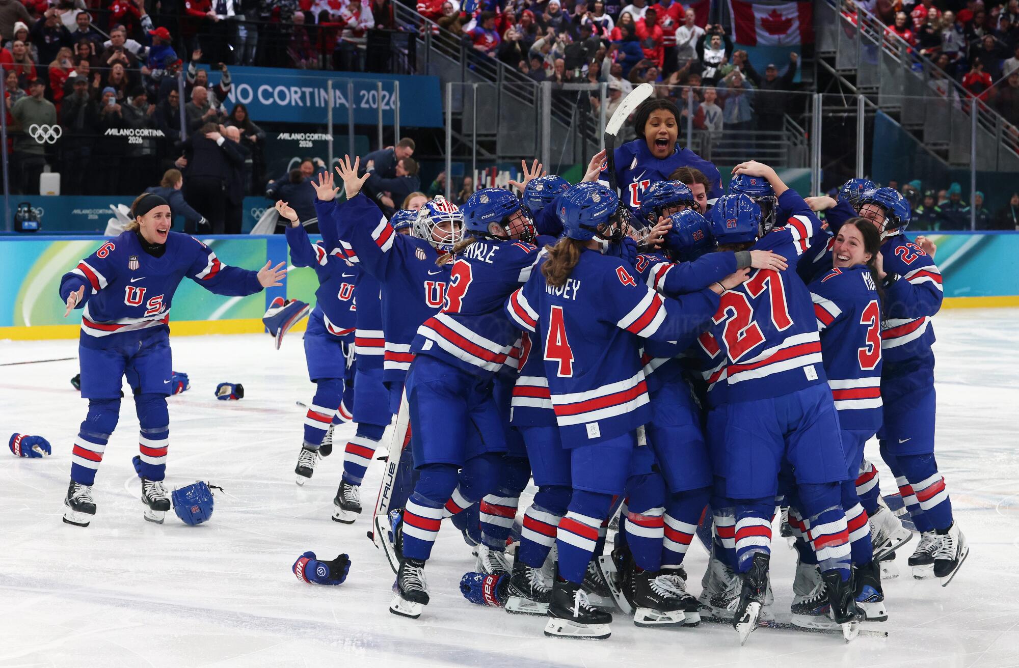 U.S. women's hockey players celebrate after beating Canada in the gold-medal game on Feb. 19.