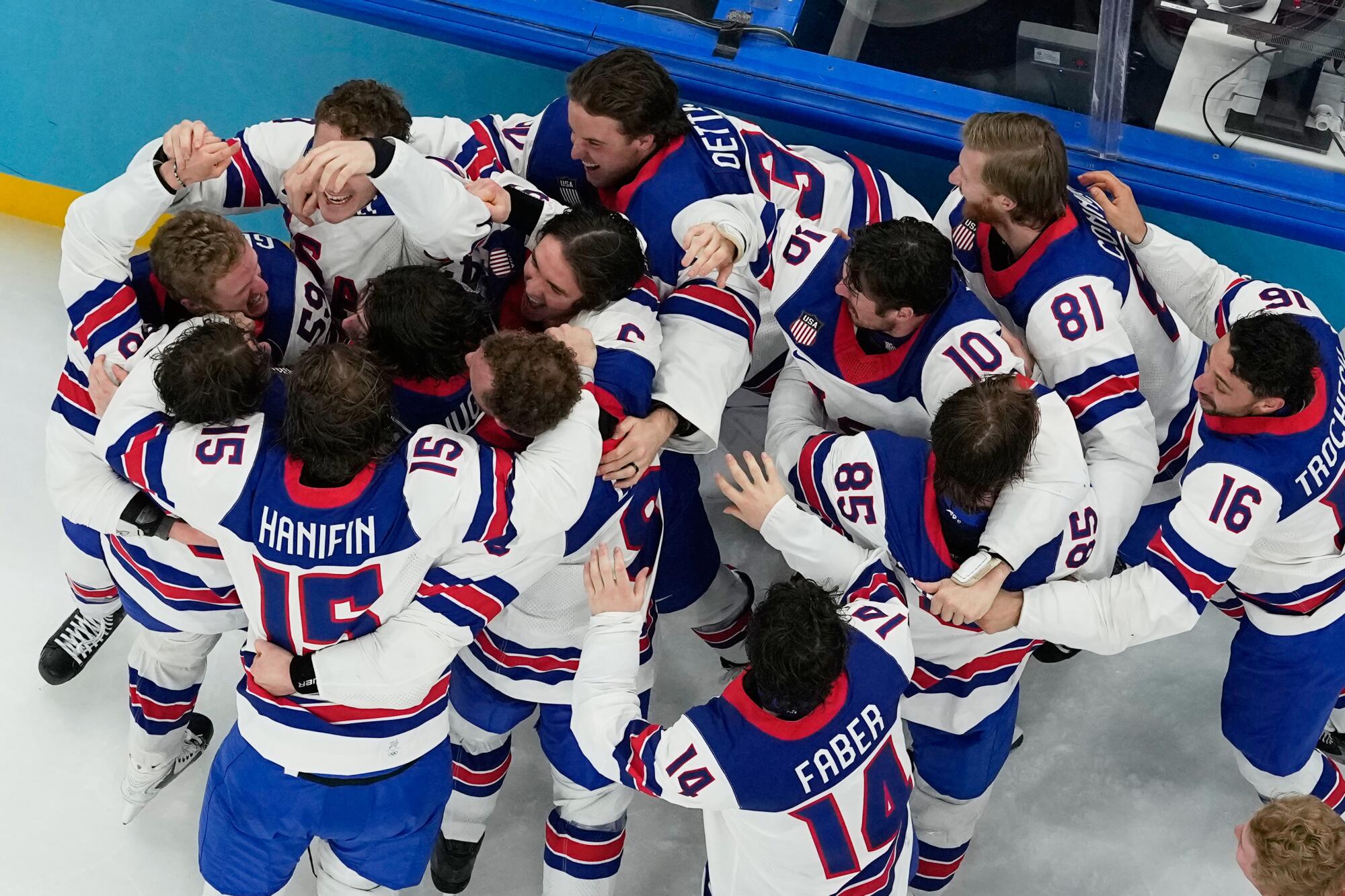 U.S. players celebrate immediately after beating Canada in overtime for the gold medal.