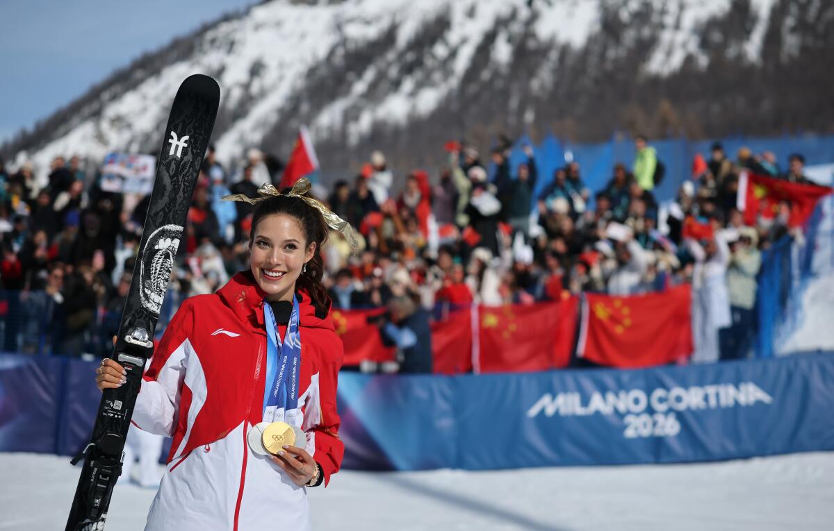 China's Eileen Gu wears her Olympic medals after winning freeski halfpipe Sunday at the Milan-Cortina Games.