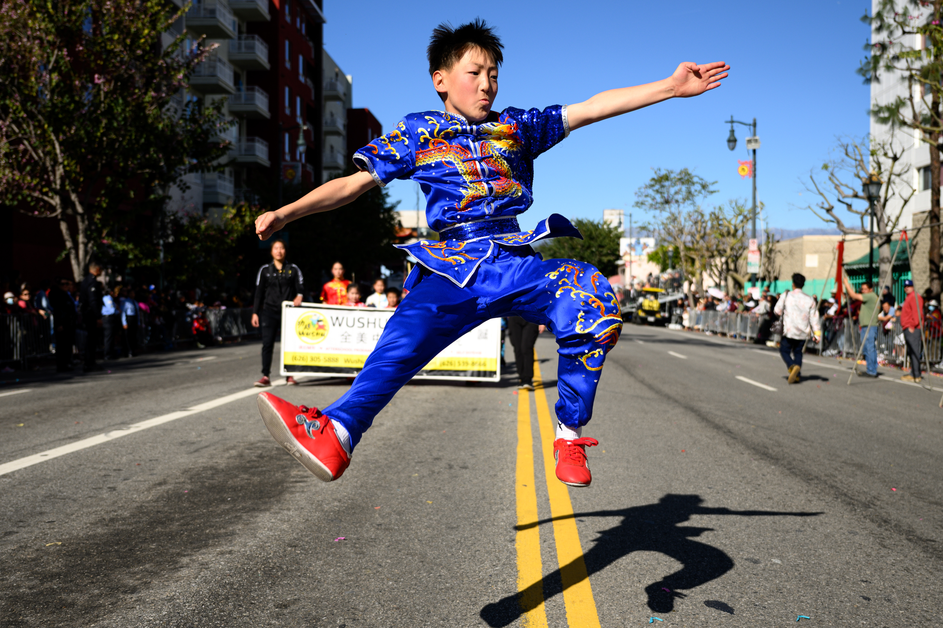 A boy does wushu during the 127th Annual Golden Dragon...