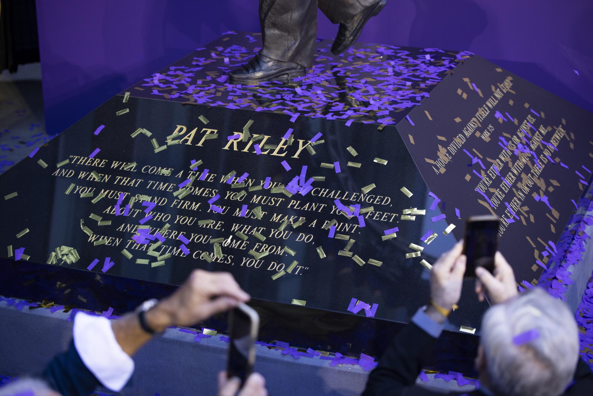 The base of Pat Riley's new statue features quotes from the former Lakers coach. It was unveiled at Crypto.com Arena.