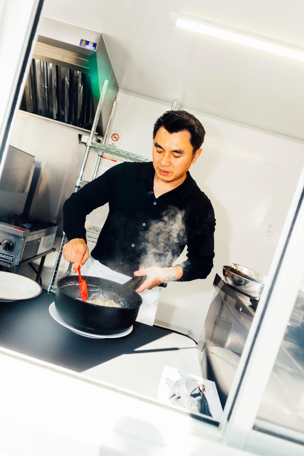 Nguyen Bui, culinary director of Next Robot, prepares risotto. 