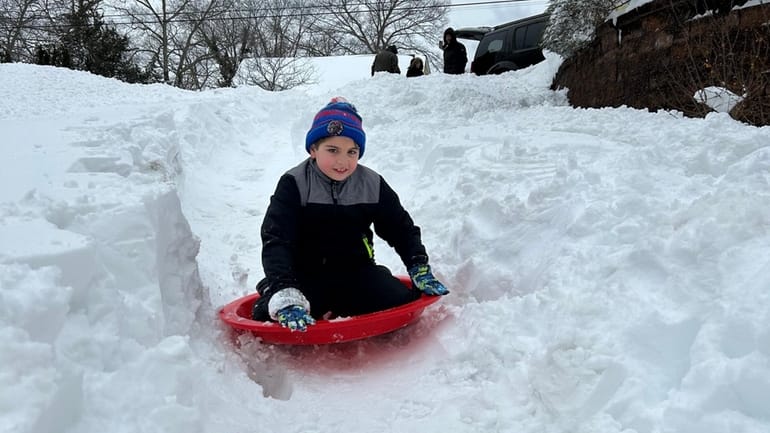 For 9-year-old Lucas Mazzarella, sliding down a frozen path outside...