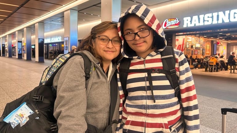 Roro Notoadisardjono, 48, of Shirley, and her son, Hampton Haryadi, 12,...