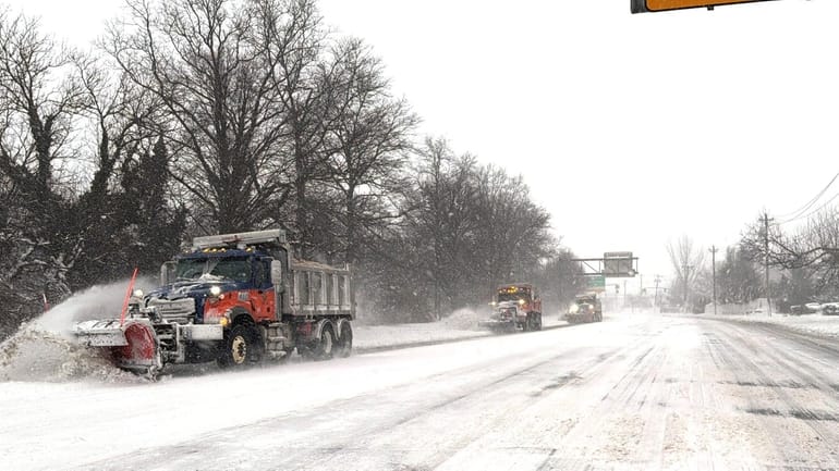 Plows clear Glen Cove Rd. on Monday in Mineola.
