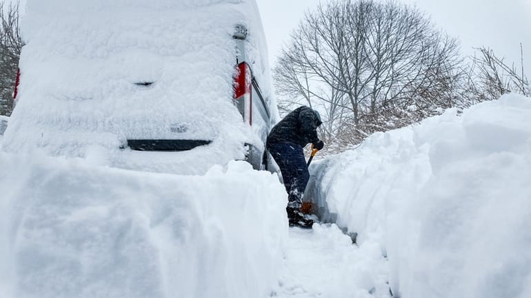 An essential worker digs his way out during a winter storm...
