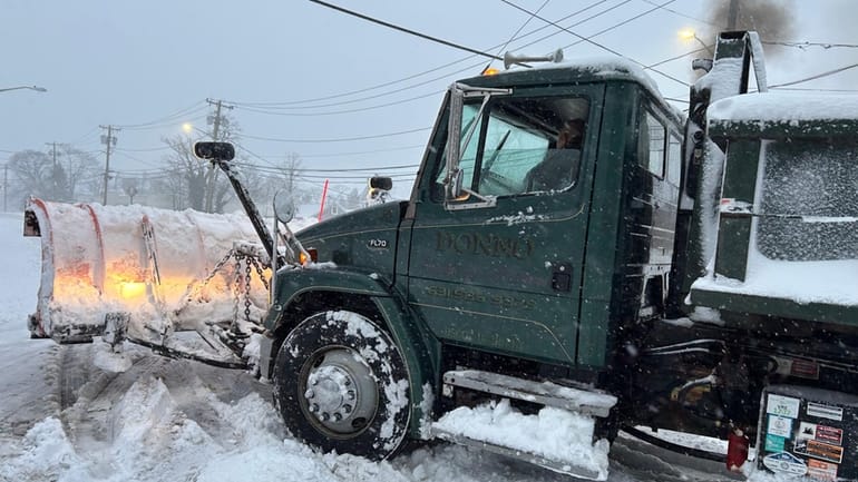 Snowplow driver Jose Cesanto, of Donno’s Landscaping, got stuck on...